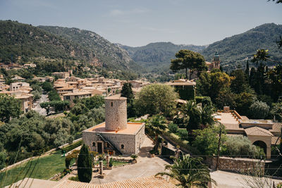 Panoramic view of buildings and mountains against sky