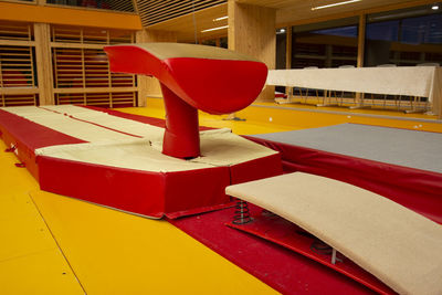 Close-up of empty seats on table in building