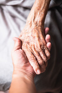 High angle view of people holding hands