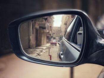 Close-up of side-view mirror of car