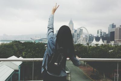 People looking at cityscape