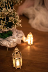 Close-up of illuminated lighting equipment on table