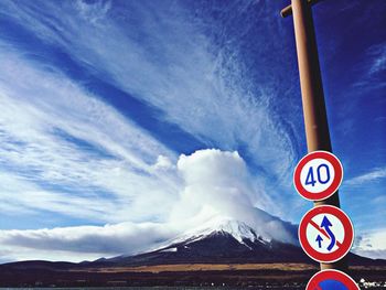 Scenic view of mountains against cloudy sky