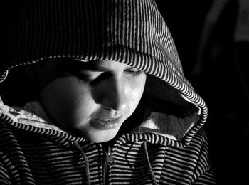 Close-up of boy wearing hooded jacket