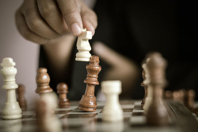 Low angle view of man playing on chess