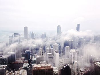 City skyline against cloudy sky