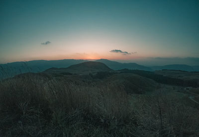 Scenic view of mountains against sky during sunset