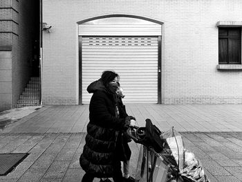 Woman wearing gas mask with baby