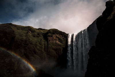 Skogafoss waterfall in southern iceland with a rainbow