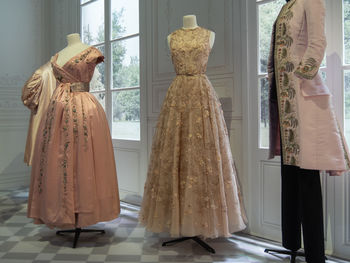 Rear view of women standing in corridor