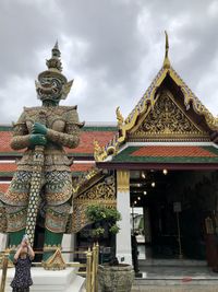 Low angle view of temple against building