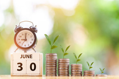 Close-up of clock on table