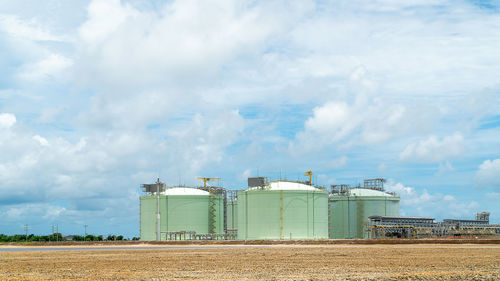 Panoramic view of factory against sky