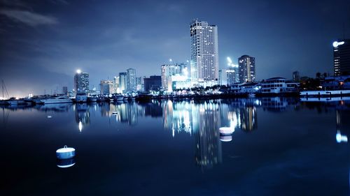 Reflection of illuminated city in water