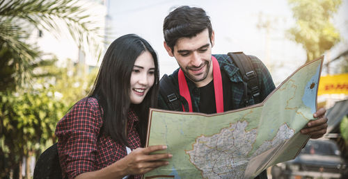 Young couple looking at camera