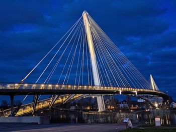 Low angle view of bridge against sky at night