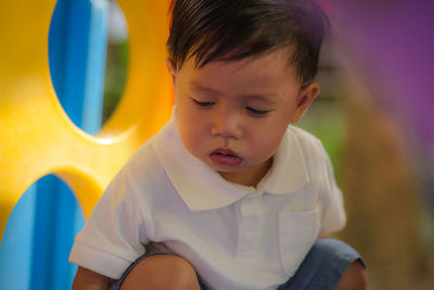 Portrait of cute boy sitting