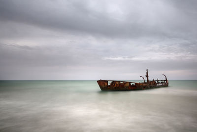 Ship in sea against sky