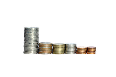 Coins stacked against white background