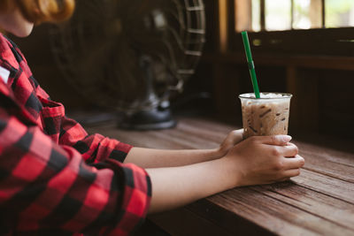 Close-up of woman sitting outdoors