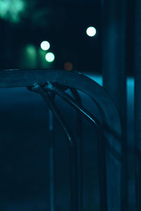 Close-up of illuminated lights on railing