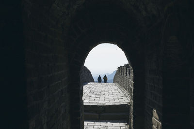 Silhouette of people walking at the great wall of china