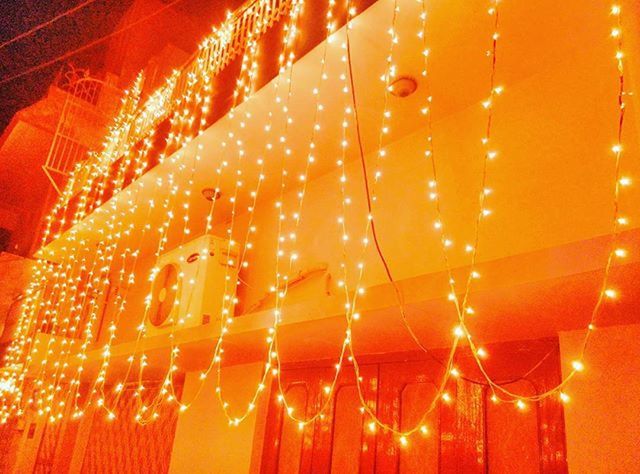 illuminated, low angle view, pattern, night, lighting equipment, close-up, indoors, hanging, decoration, glowing, full frame, light - natural phenomenon, no people, red, electricity, design, focus on foreground, backgrounds, light, orange color