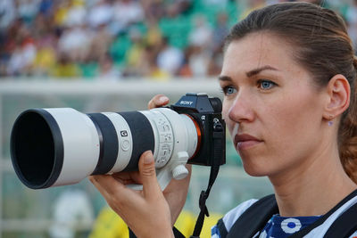 Close-up of photographer photographing through smart phone