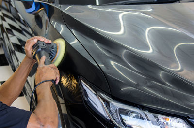 High angle view of man taking selfie in car