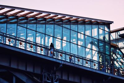 Low angle view of bridge against sky in city