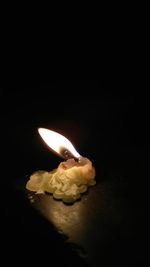 Close-up of illuminated lamp in darkroom