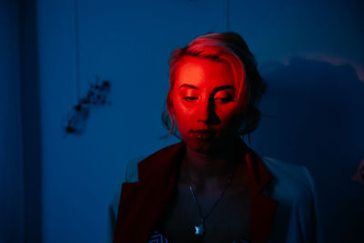 Close-up of beautiful young woman in darkroom