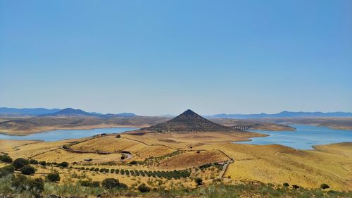 Scenic view of landscape against clear blue sky