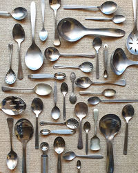 High angle view of kitchen cutlery flat lay on table 