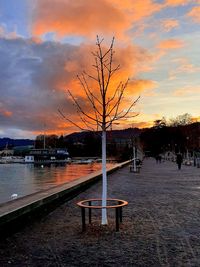 Scenic view of lake against sky at sunset