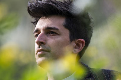 Close-up of young man looking away