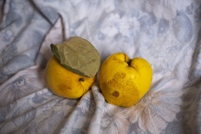 High angle view of yellow fruits on bed