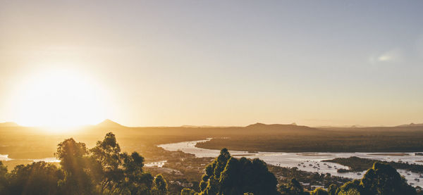 Scenic view of landscape against sky during sunset