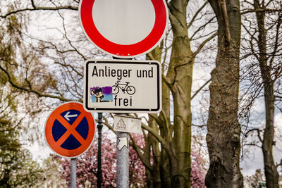 Low angle view of signboard on pole