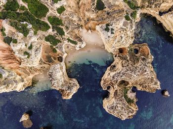 Aerial view of coastline by sea