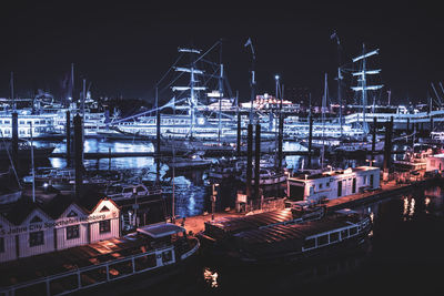 High angle view of illuminated city buildings at night