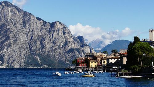 Scenic view of sea and mountains against clear sky