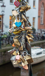 Love lock padlocks on bridge over the canal in amsterdam