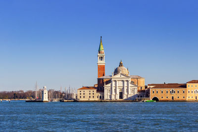 View of buildings against blue sky