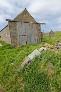 House on field against sky