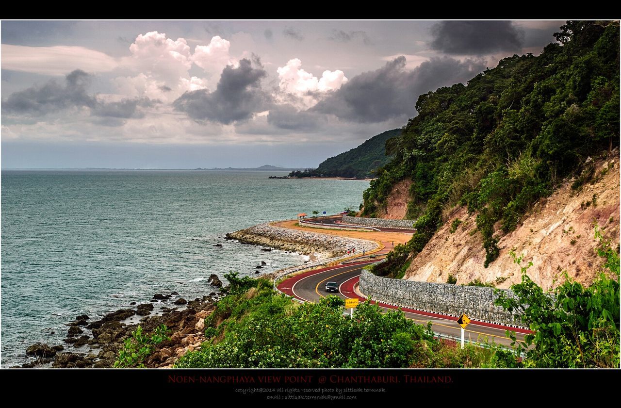 sea, water, sky, horizon over water, cloud - sky, tranquil scene, built structure, high angle view, scenics, coastline, cloudy, cloud, tranquility, nature, architecture, beach, beauty in nature, tree, shore, day