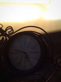 Close-up of clock on wall