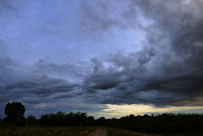 Scenic view of dramatic sky over land