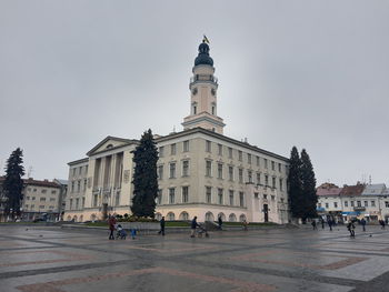 Group of people in front of building