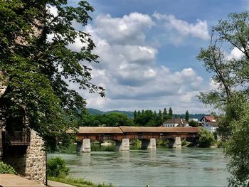 Gazebo by trees against sky